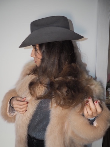 Grey felt hat worn with a fur coat